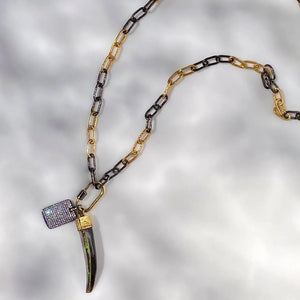 32” Two-Toned Chunky Chain Charm Necklace with Iridescent Tusk Charm Symbolizing Resilience.